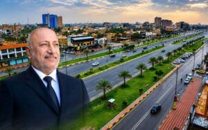 محافظ كربلاء نصيف الخطابي ومنظر من أحد شوارع المدينة